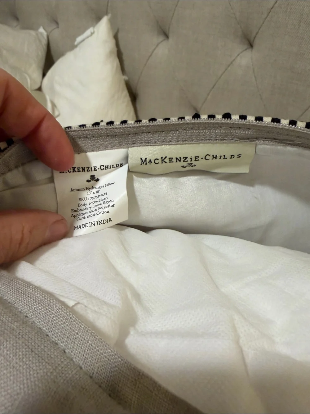 Mackenzie-Childs Brass Oval Logo Tag on Textured Fabric Pillow
